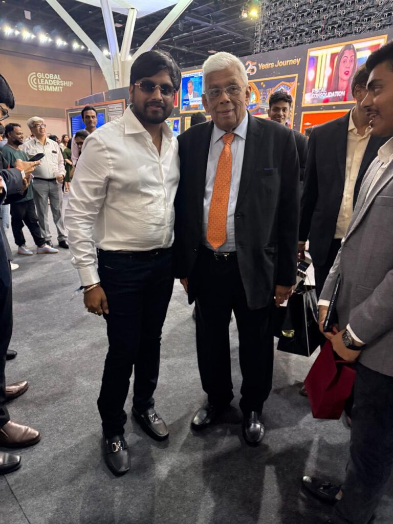 Two men posing at a leadership summit